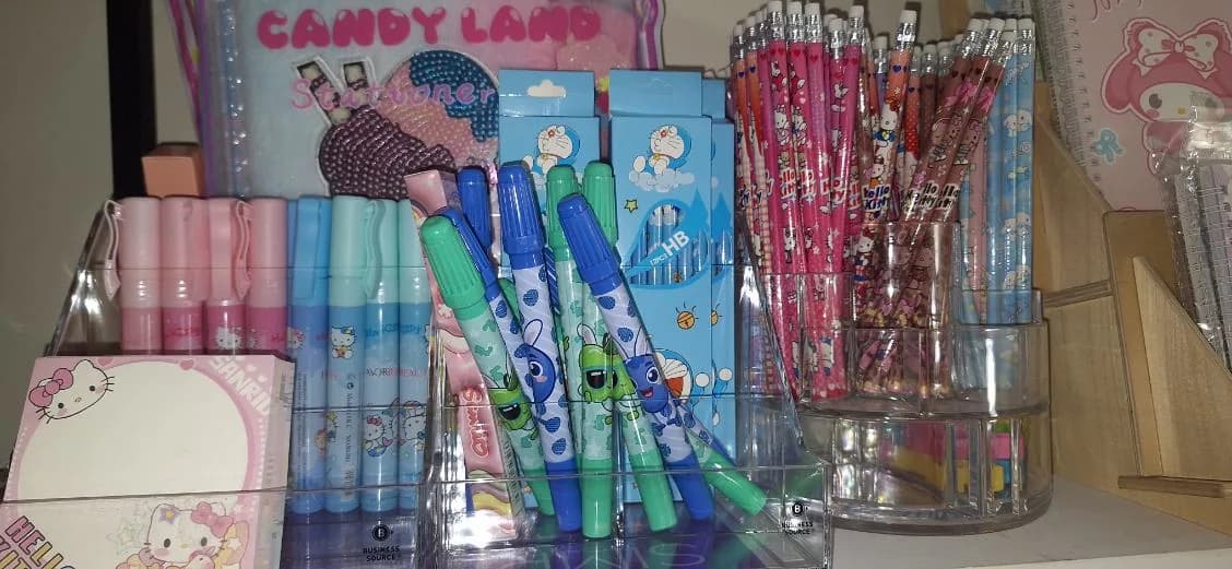 Colorful pens, pencils, notebooks, and small stationery prizes