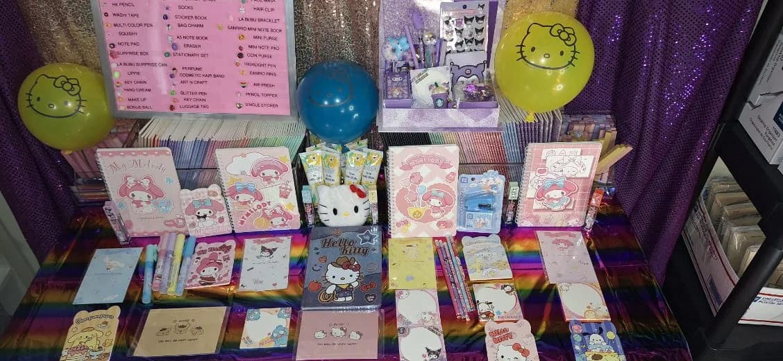 A colorful table filled with party prizes and surprise boxes